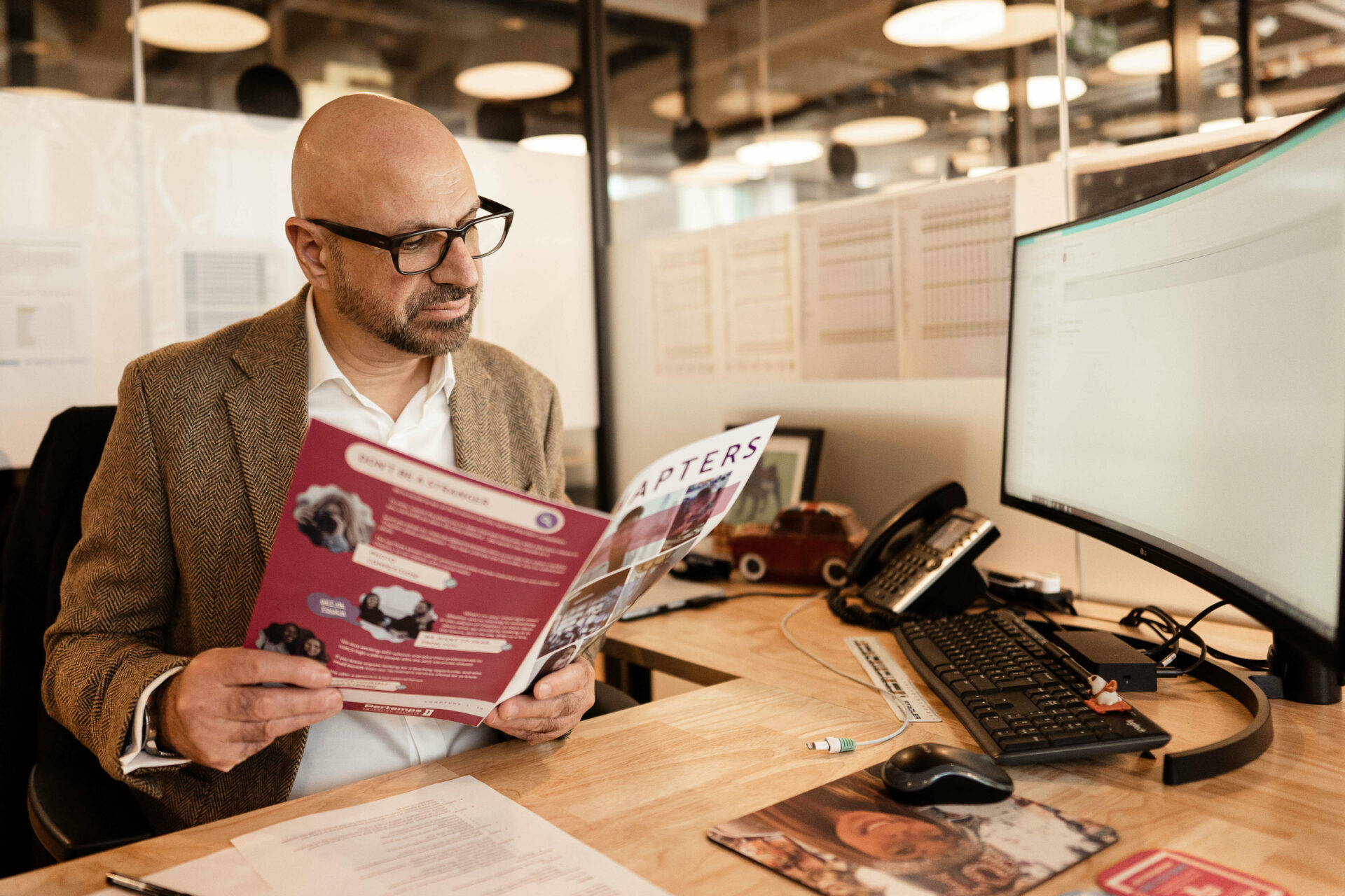 andrew reading at his desk